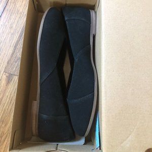 Brand new, never worn, black Toms flats.